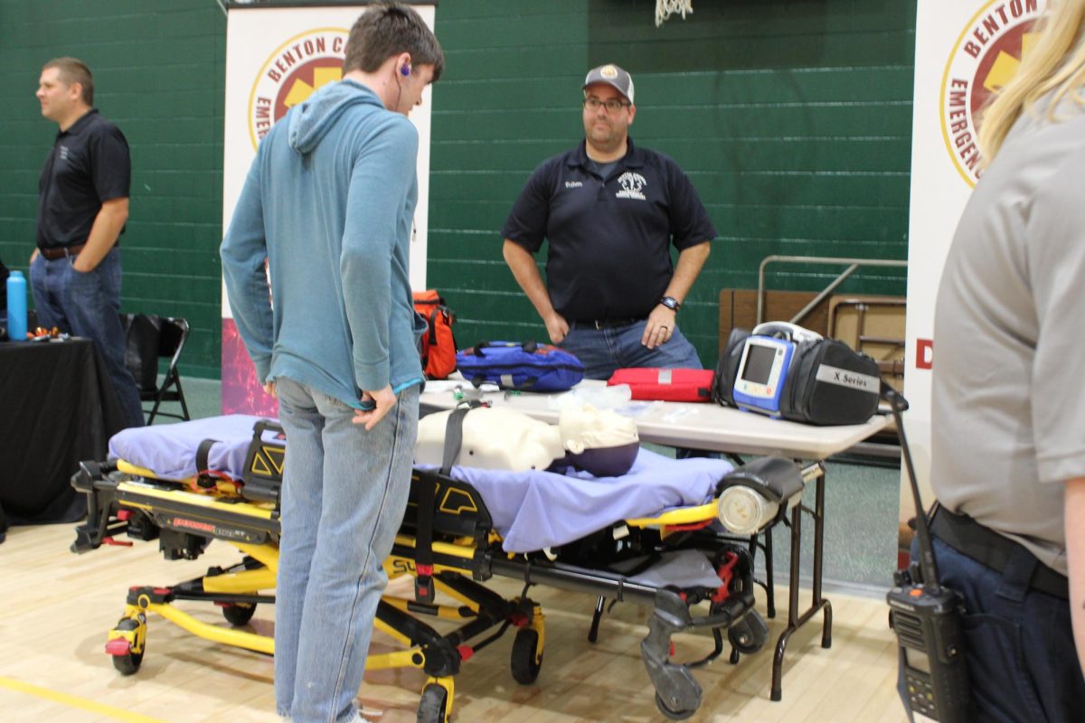 Benton County EMS Representative conversing with an interested student.