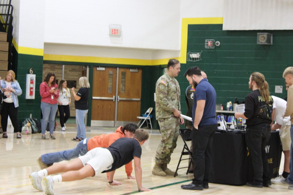 Students showing their athletic prowess to the Army booth.