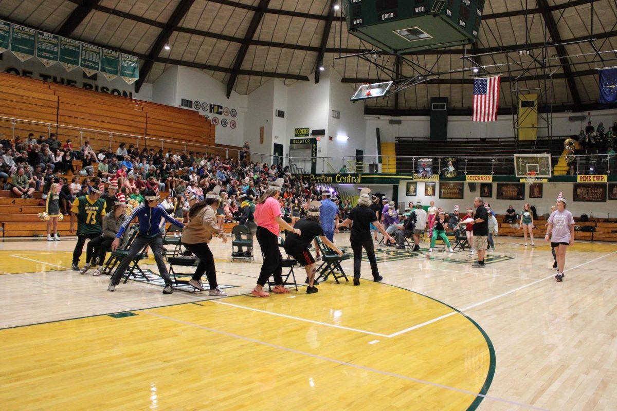 Students from all grades competing in a game of Musical Chairs.