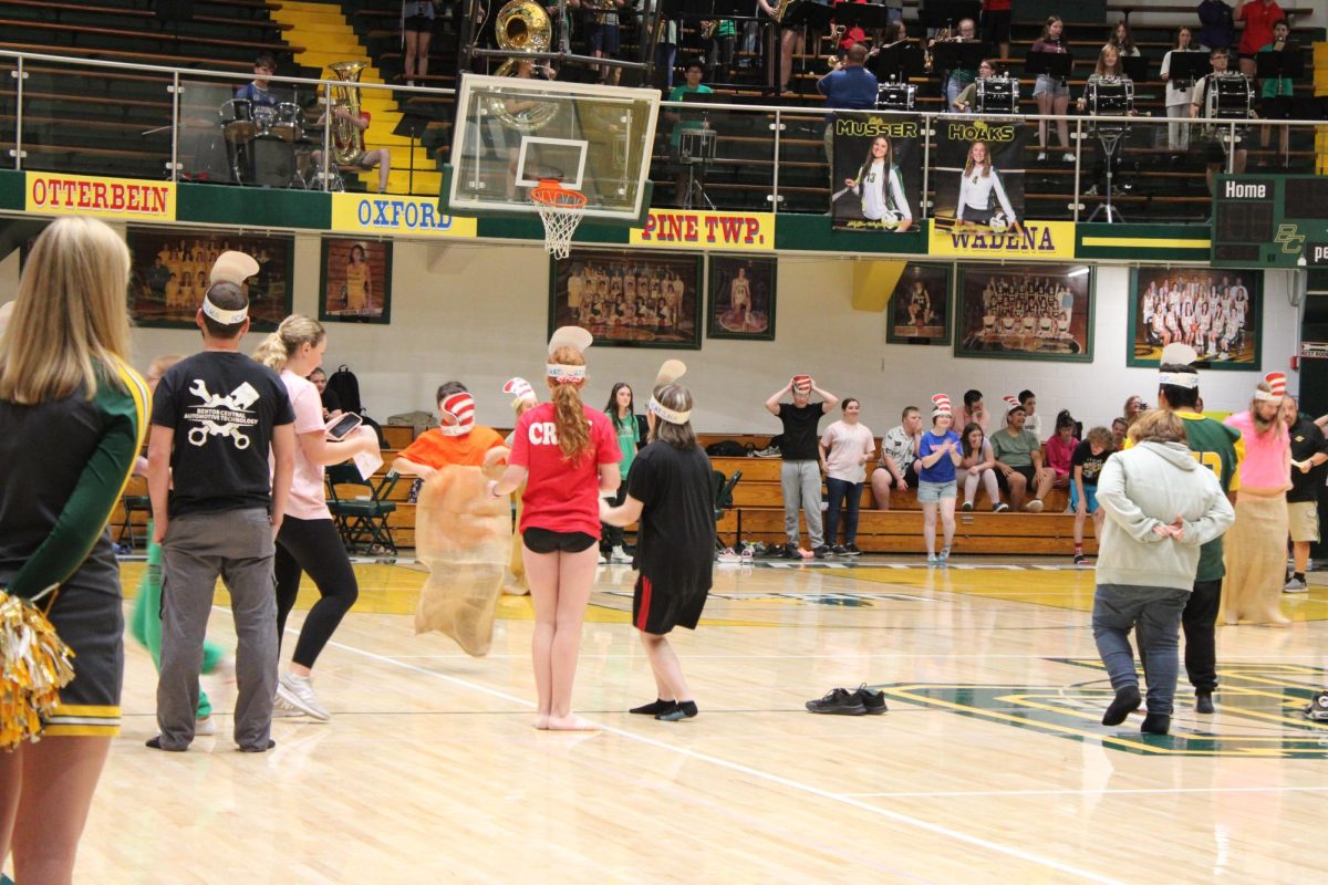 A young student about to pass the finish line during the Burlap Sack race.