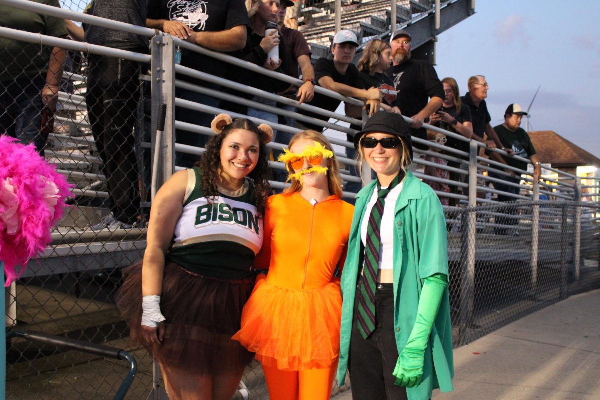 Seniors Emily Rodriguez, Savannah Wirtz, and Reece Kerkhoff dressed up as a Barbalot, the Lorax, and the Onceler, from the Lorax movie. 