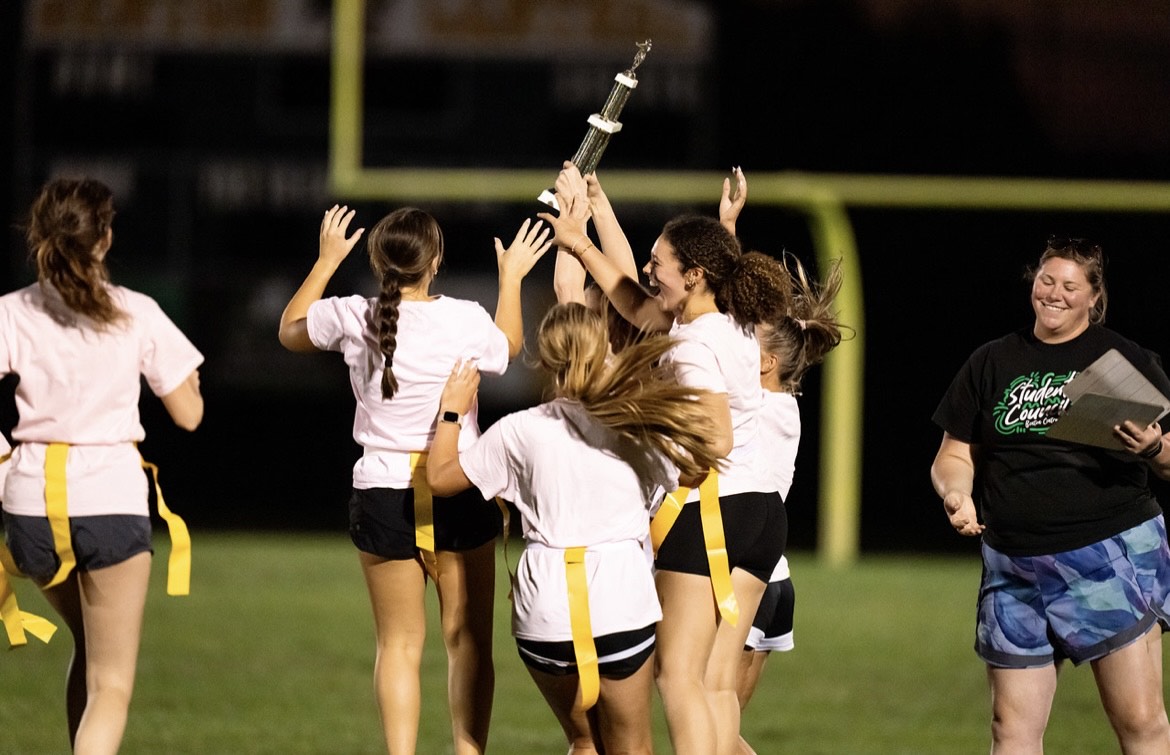 Senior girls celebrate after winning the third & final Powderpuff game of the night! Photo by Jen Foster. 