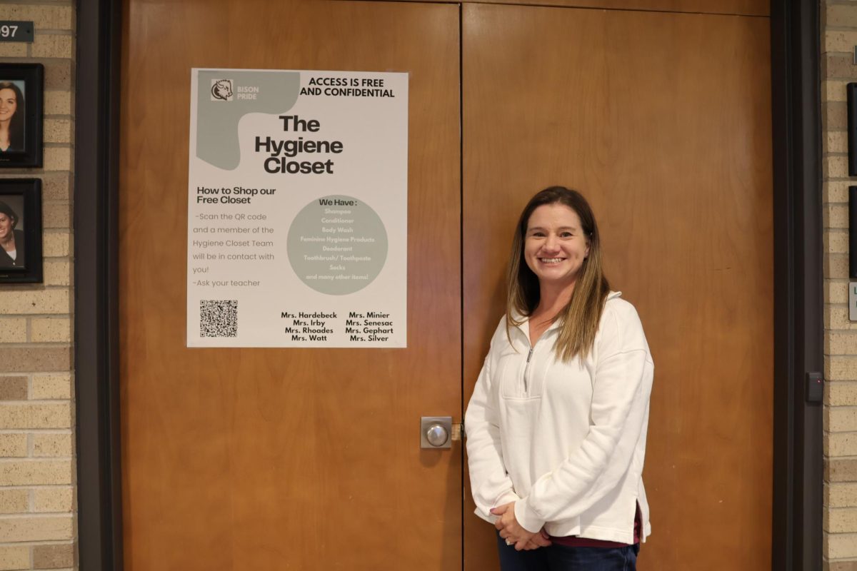 School Therapist Danielle Irby standing next to the Hygiene Closet