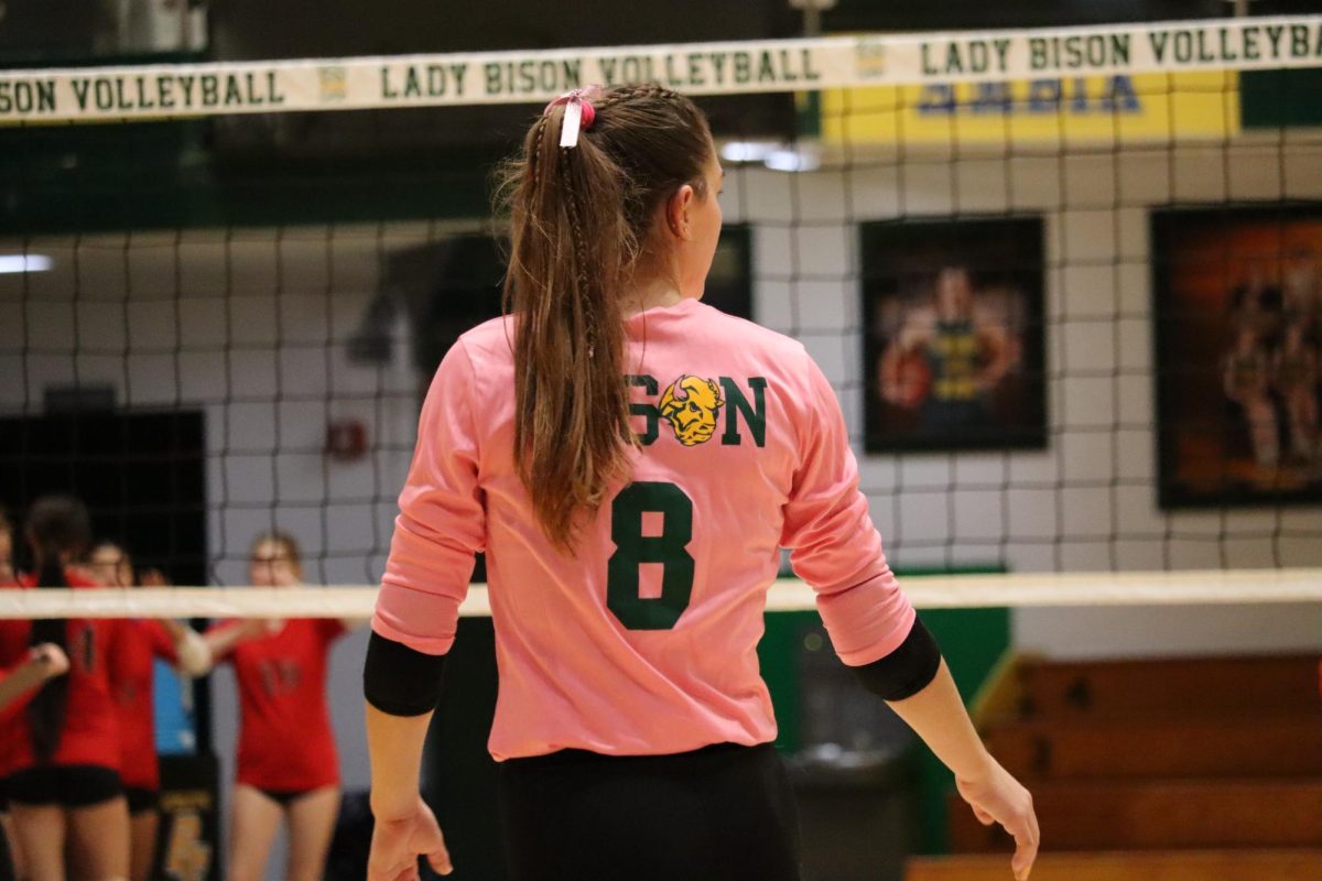 Calista Foster standing at the net against Renssealer. 