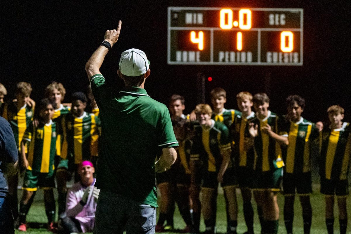 Head Coach James Warf celebrates a senior night victory