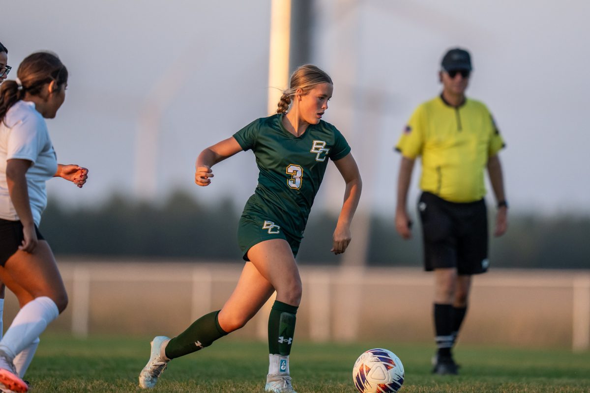 Freshmen Adalynn Keller running for the ball